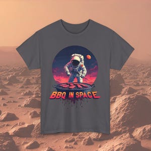 BBQ in Space Astronaut Grilling T-Shirt - Fun Sci-Fi BBQ Lover Tee | Unique Gift for BBQ & Space Enthusiasts | Unisex Cotton Shirt