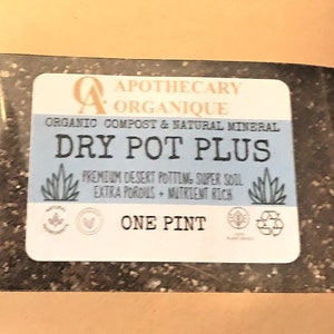 May include: A brown paper bag containing potting soil. The label reads "Dry Pot Plus" and "One Pint". The label also states that the soil is organic compost and natural mineral, premium desert potting, super soil, extra porous, and nutrient rich.
