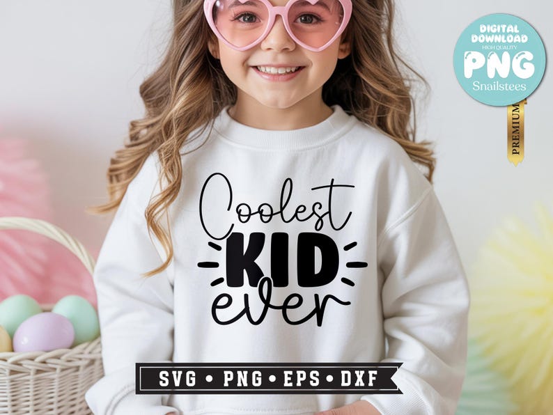 May include: A white sweatshirt with the text "Coolest KID ever" in black script. The image includes a digital download badge and a banner with "SVG &bull; PNG &bull; EPS &bull; DXF". The person in the image is wearing pink heart-shaped sunglasses.