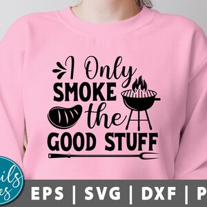 May include: Pink sweatshirt with a black graphic that says "I Only Smoke the Good Stuff" with a grill, flames, and a steak.