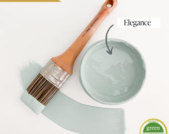 May include: A light blue paint color called "Elegance" by Country Chic Paint. The paint is shown in a small container with a paint brush next to it. The paint is certified Green Wise Gold.