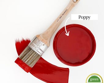 May include: A red paint sample with the text "Poppy" and a paint brush with a red paint stroke. The paint is certified Green Wise Gold.