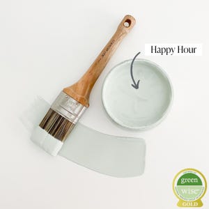 May include: A paint brush and a container of light blue paint labeled "Happy Hour". The paint is certified Green Wise Gold.