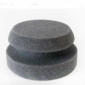 May include: A gray, round, double-layered foam pad for polishing or buffing.