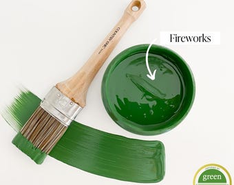 May include: A green paint in a white bowl with a paint brush and a green paint stroke. The paint is labeled "Fireworks" and has a "Green Wise Gold" certification.
