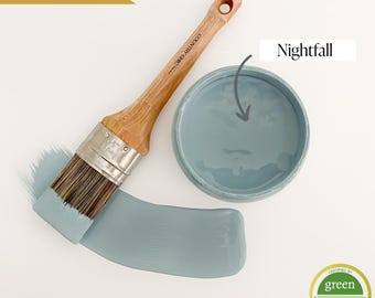 May include: A paint brush and a sample of Nightfall paint, a light blue color, from Country Chic Paint. The paint is certified Green Wise Gold.