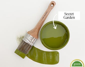May include: A green paint can with a paintbrush and a sample of the paint color, labeled "Secret Garden". The paint is certified Green Wise Gold.