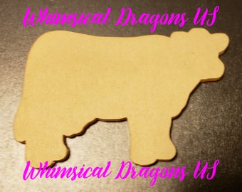 May include: A wooden cutout in the shape of a cow. The cow is light brown and has a detailed outline. The text "Whimsical Dragons US" is written in pink cursive across the top and bottom of the image.