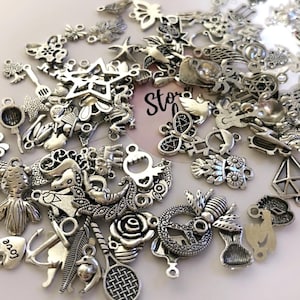 100 Pcs assorted silver charms for jewelry making