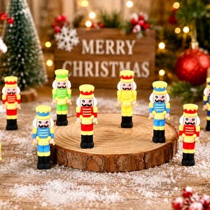 May include: A collection of ten small nutcracker figurines in various bright colors including red, yellow, green, and blue. Each nutcracker features a painted face with a mustache, a uniform, and a hat, standing upright on a wooden surface.