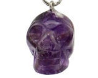 May include: A purple amethyst skull keychain with a silver key ring and chain.