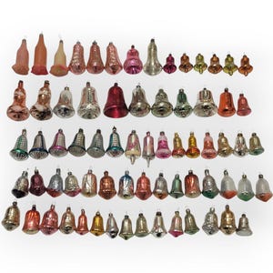 May include: A selection of vintage Christmas bell ornaments in various colours. The ornaments include red, gold, silver, and green bells, some with glitter. The bells vary in size and design, creating a festive display for the holiday season.