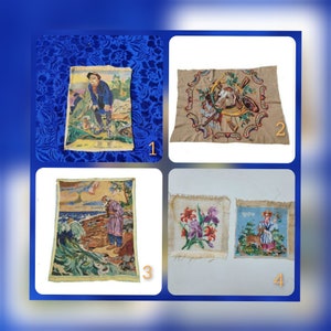 May include: Four framed needlepoint embroidery pieces. The first piece depicts a man in a blue shirt and brown pants holding a shovel. The second piece features a brown and white cow with a red and green floral design. The third piece shows a man in a purple shirt and brown pants standing on a beach with a wave behind him. The fourth piece shows a woman in a blue dress and white apron standing with a cow in a green field.
