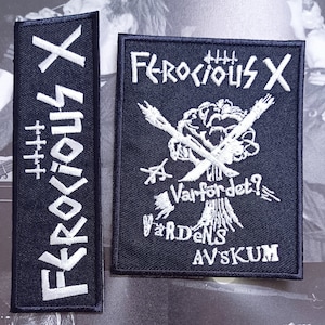 May include: Two black embroidered patches with white lettering. The larger patch features a skull and crossbones with the text "Ferocious X", "Varfordet?", "Vardens", and "Avskum". The smaller patch features the text "Ferocious X".