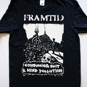 May include: Black t-shirt with a white graphic print of a band called "Framtid" with the text "Consuming Shit & Mind Pollution".