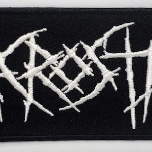 May include: A black embroidered patch with the word "AARGH" in white, stylized in a jagged, gothic font.