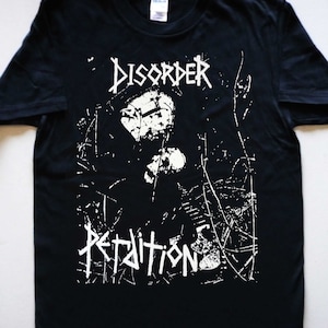 May include: Black t-shirt with a white graphic print of a skull and the words "DISORDER" and "PETITION".