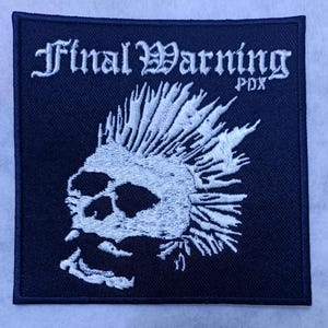 Broderad lapp: Slutlig varning pdx Ikonoklast Slutlig konflikt MDC Krucifix