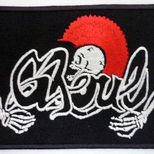 May include: White embroidered patch with a skull wearing a red mohawk and the word "Ghouls" in a stylized font.