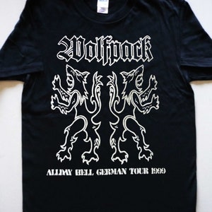May include: Black t-shirt with a white graphic of two wolves and the text "Wolfpack Allday Hell German Tour 1989".
