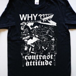 May include: Black t-shirt with a white graphic print of a punk rock band with the text "WHY????" and "contrast attitude".