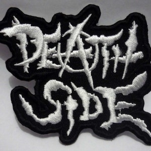 May include: White embroidered patch with the words "Death Side" on a black background.