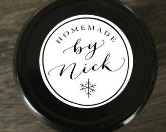 May include: A black jar with a white label that says "Homemade by Nick" with a snowflake design.