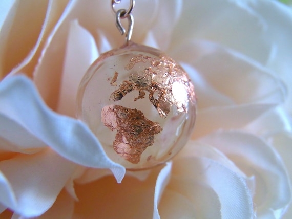 Rose gold globe best sale necklace
