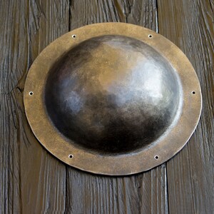 Umbon size - outer diameter - 18.5 cm, inner diameter - 14 cm, height - 6.5 cm, width of flat boots 2-3 cm. Umbon is made of 2-3 mm metal, forged, polished, not hardened.