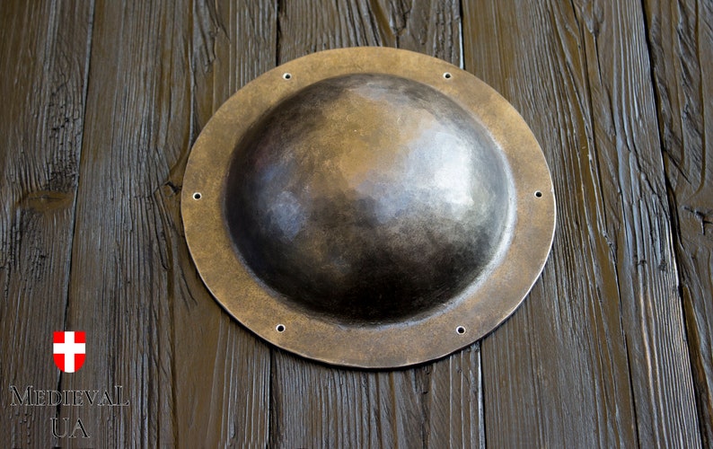 Umbon size - outer diameter - 18.5 cm, inner diameter - 14 cm, height - 6.5 cm, width of flat boots 2-3 cm. Umbon is made of 2-3 mm metal, forged, polished, not hardened.