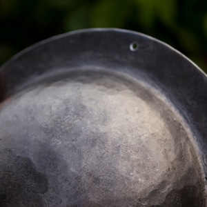 on the flat sides of the umbon there are 6 holes of 3.2 mm for nailing the umbon to the shield with nails.