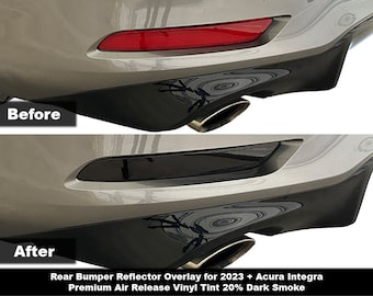 May include: Before and after images of a rear bumper reflector overlay for a 2023 Acura Integra. The overlay is a dark smoke tint vinyl that covers the reflector. The text "Rear Bumper Reflector Overlay for 2023 + Acura Integra Premium Air Release Vinyl Tint 20% Dark Smoke" is below the images.