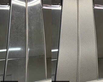 May include: A side-by-side comparison of vehicle B and C pillars. The left side shows the original glossy black finish, while the right side displays a black carbon fibre vinyl wrap overlay applied to the pillars of a Jeep Grand Cherokee 2011-2022.