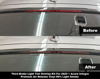 May include: A comparison of a vehicle's third brake light before and after applying a 50% light smoke tint overlay. The image displays the rear window and light assembly of a 2023 Acura Integra with the text Third Brake Light Tint Overlay Kit.