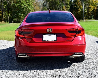 May include: A red Honda Accord Sport sedan with blacked-out taillights and a rear license plate that reads "YOUNGSTOWN, OHIO THE WONDER'S STORE".