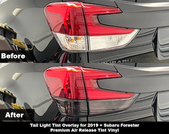 May include: Comparison of a Subaru Forester's taillights before and after tinting. The top image shows the original taillight design with clear lenses and bright red brake lights. The bottom image shows the tinted taillights, with a darker, more uniform appearance.