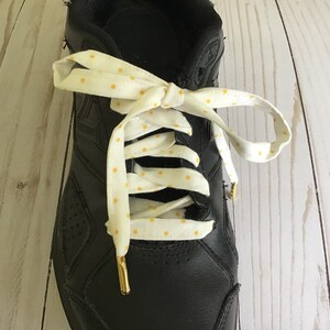 Yellow Metal Shoe Lace Tips aglets 