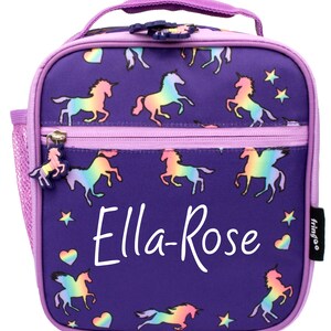 May include: Purple lunch bag with a zipper closure and a mesh side pocket. The bag has a rainbow unicorn print and the name "Ella-Rose" is written in white on the front. The bag has a purple handle and a "fringoo" logo.