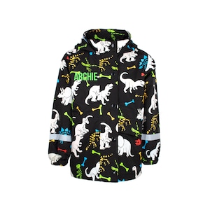Fringoo Personalisierter Regenmantel für Jungen - Dinosaurier Regenmantel - Kinder Wasserdichte - Farbwechsel Mantel - Schwarz Alter 1-6