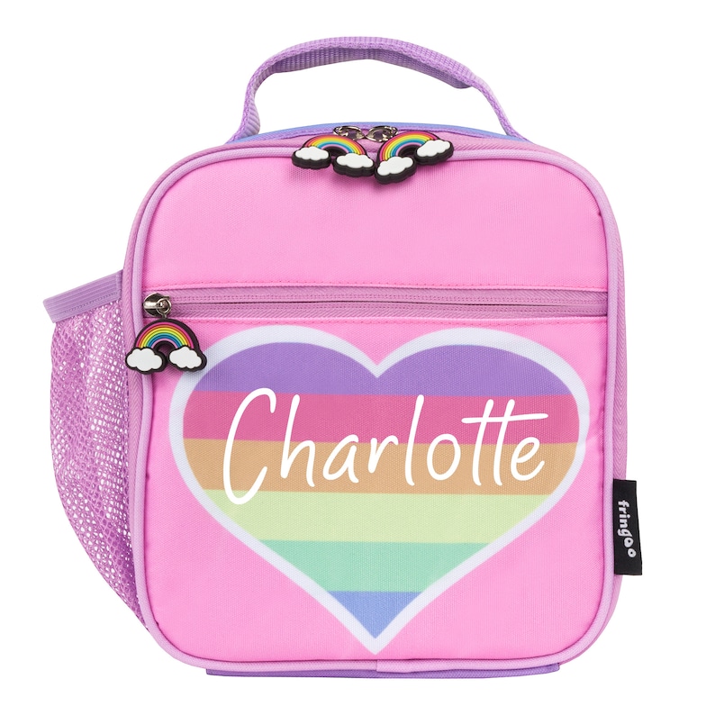 May include: Pink lunch bag with a rainbow heart design and the name "Charlotte" written in white. The bag has a mesh side pocket and a zipper closure.