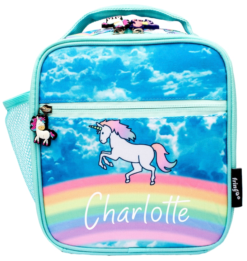 May include: A turquoise blue lunch bag with a unicorn and rainbow design. The bag has a mesh side pocket and a zipper closure. The bag is personalized with the name "Charlotte".