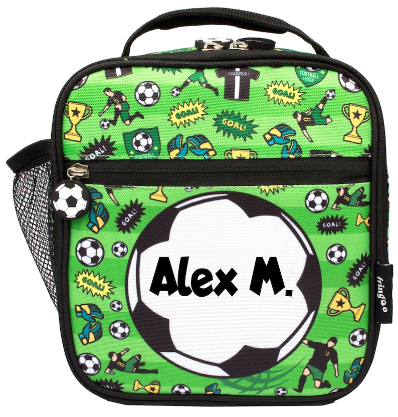 May include: Green lunch bag with a soccer ball design. The bag has a black zipper and a mesh side pocket. The soccer ball has the name "Alex M." written on it.