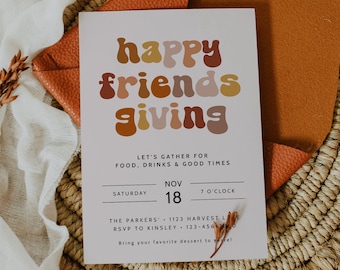 May include: A white card with the text "happy friends giving" in colorful, rounded letters. The card is on a woven basket with a brown leather pad and a white cloth. The text on the card reads "Let's gather for food, drinks & good times. Saturday, Nov 18, 7 o'clock. The Parkers, 1123 Harvest Lane, RSVP to Kinsley 123-456-7890. Bring your favorite dessert to share!"