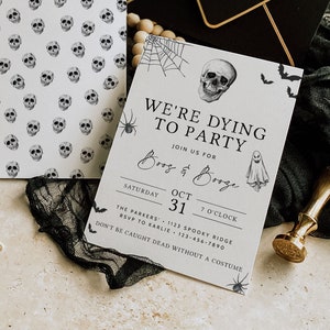 May include: A black and white Halloween party invitation with a skull and ghost graphic. The text reads "We're Dying to Party" and includes the date, time, and location of the party.