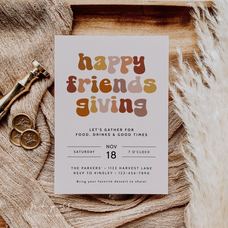 May include: A light gray invitation card with the text "happy friends giving" in colorful, retro-style lettering. The invitation details a gathering for food, drinks, and good times on Saturday, November 18th at 7 o'clock at The Parkers, 1123 Harvest Lane. It also includes an RSVP number and a request to bring a dessert to share.