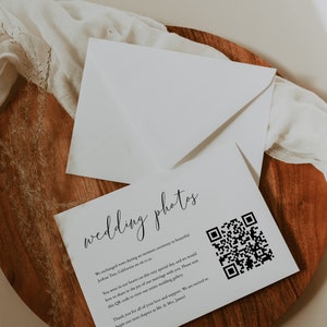 May include: A white card with black text that reads "wedding photos" and a QR code. The text says "We exchanged vows during an intimate ceremony in beautiful Joshua Tree, California on 06.11.12. You were in our hearts on this very special day, and we would love to share in the joy of our marriage with you. Please scan this QR code to view our entire wedding gallery. Thank you for all of your love and support. We are excited to begin our next chapter as Mr. & Mrs. James!"
