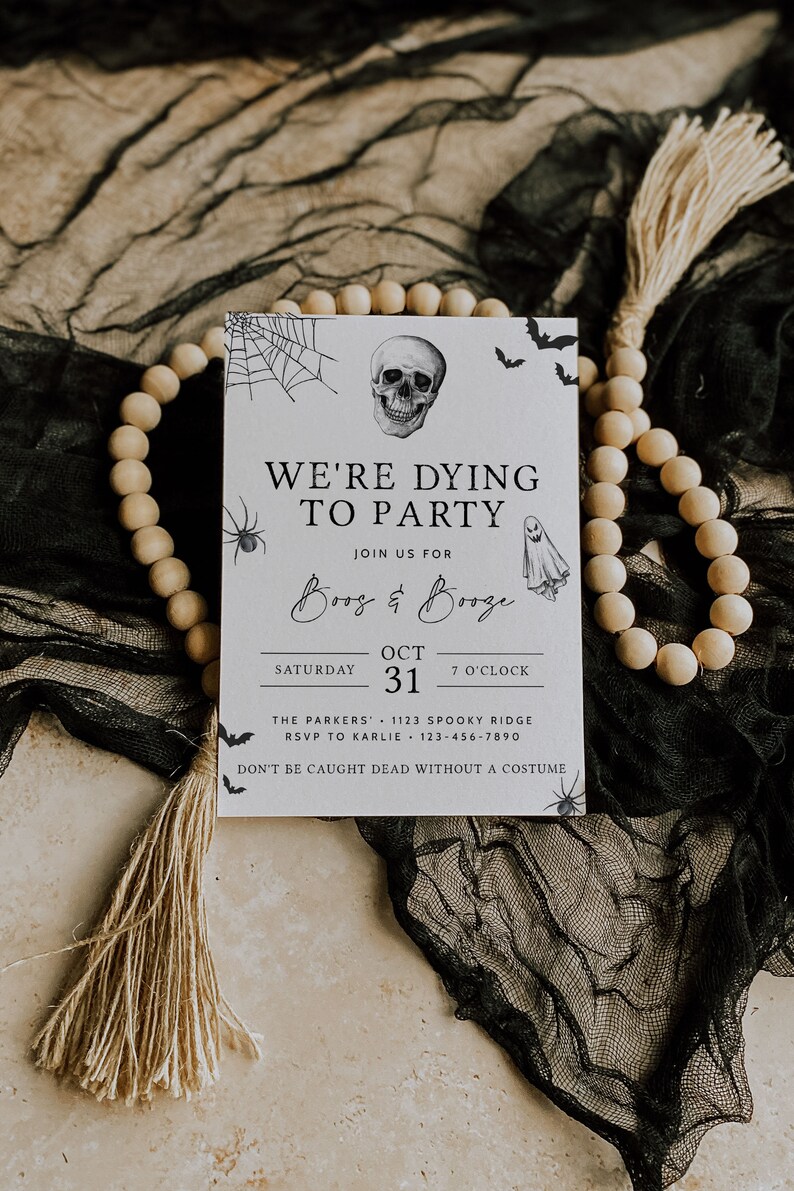 May include: A white Halloween party invitation with black text and illustrations. The text reads "We're Dying to Party" and "Boo's & Booze". The invitation includes the date "October 31st" and the time "7 o'clock".