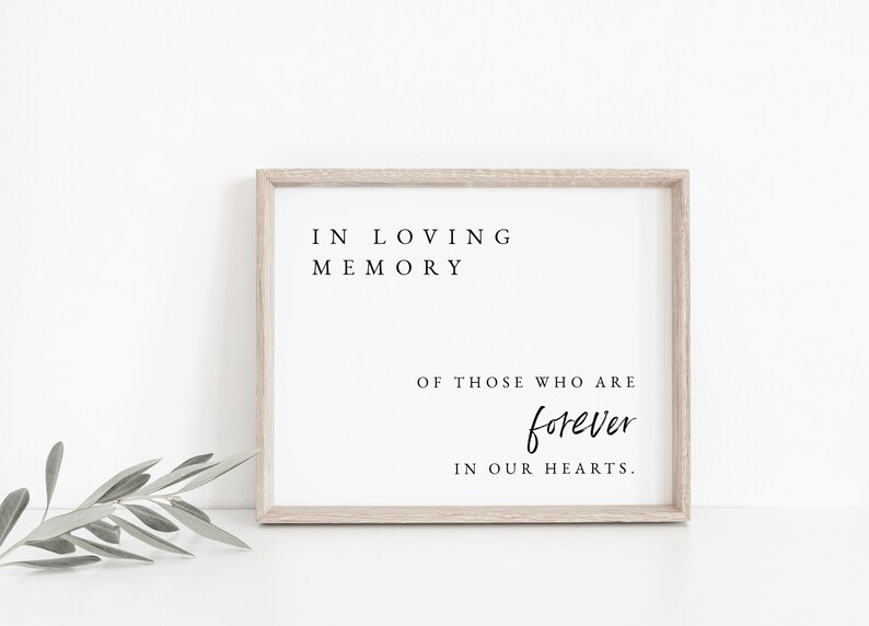 May include: A framed print with the text "In loving memory of those who are forever in our hearts."