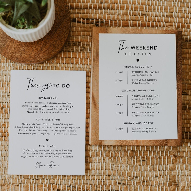 May include: A white card with black text listing things to do in Aspen, Colorado, including restaurants, activities, and fun. The card also includes a thank you message and the names Olivia and Bran. A second white card with black text lists the weekend details for a wedding, including the date, time, and location of the wedding rehearsal, ceremony, and reception.