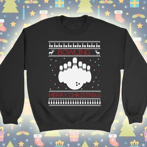 May include: Black sweatshirt with a white bowling pin design and the text "Bowling Merry Christmas".
